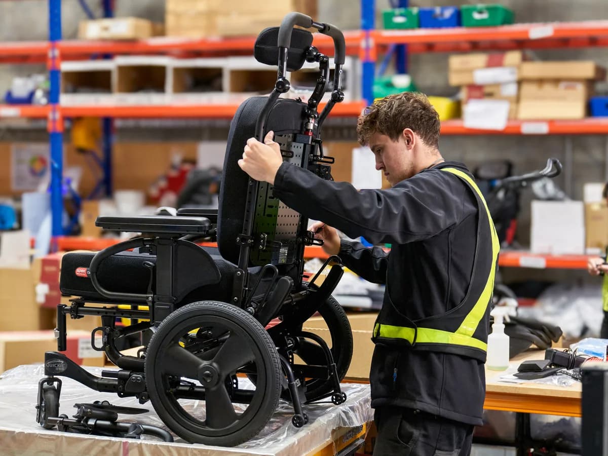 Spex technician assembling a seating system in the manufacturing area