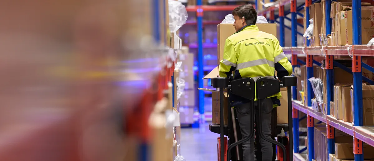 Medifab warehouse operator picking an order from racking at the Canterbury facility