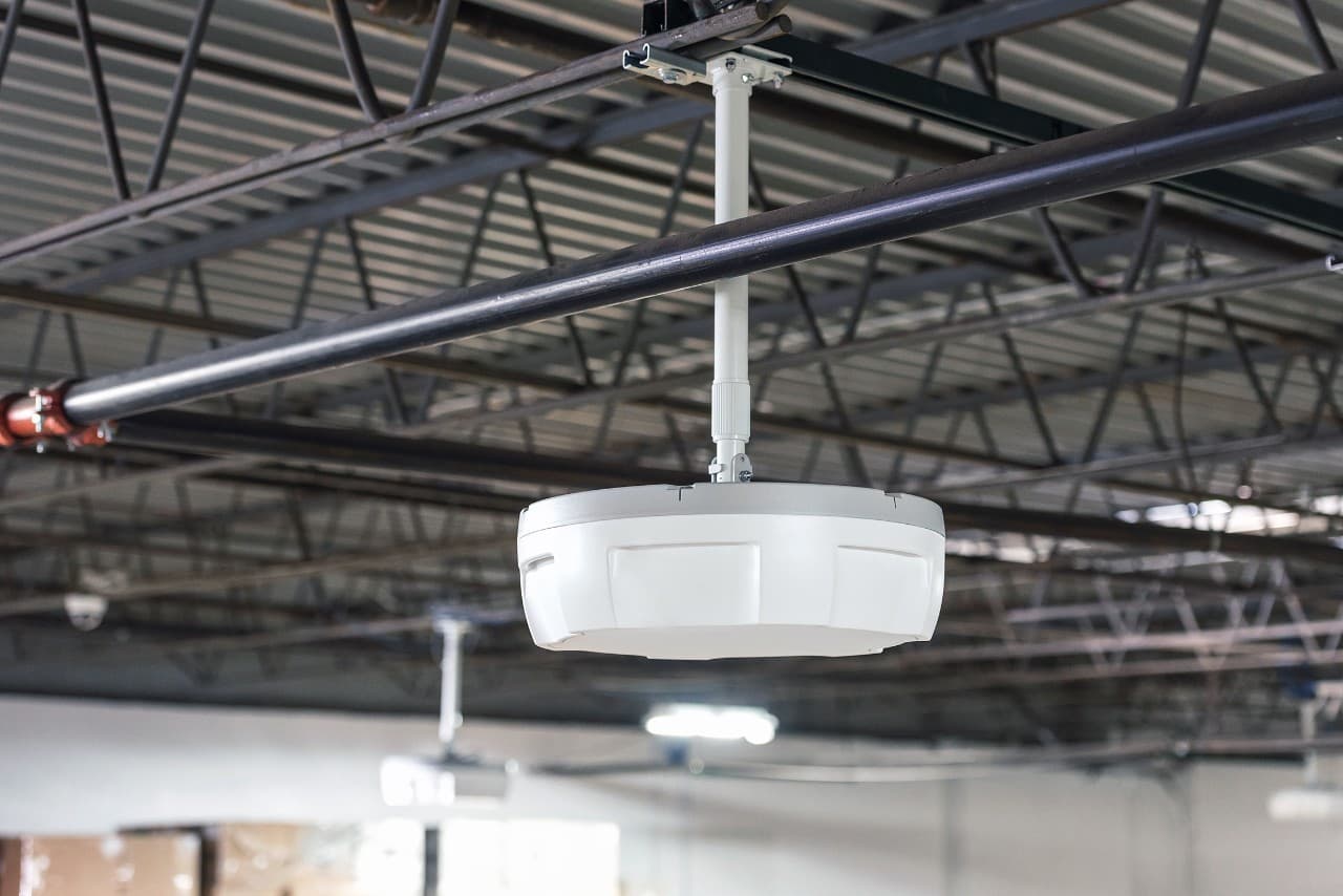 Zebra ATR7000 overhead RFID array mounted on warehouse ceiling for wide-area inventory tracking
